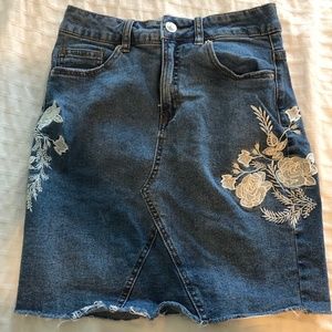 Denim skirt with floral detailing